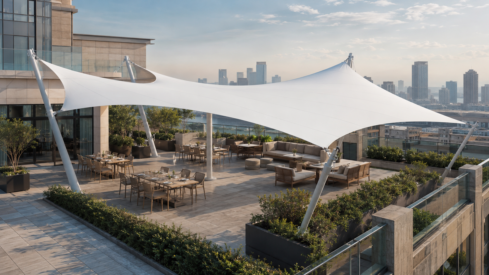 White rooftop tensile membrane structure covering a hotel terrace