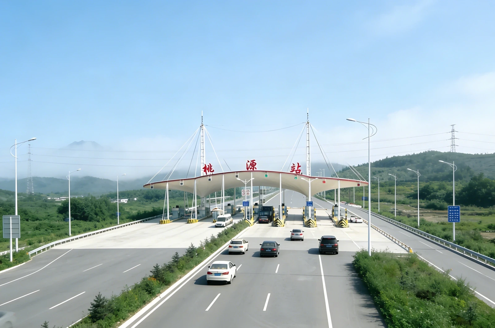 Aerial view of a toll station with a membrane canopy over the lanes
