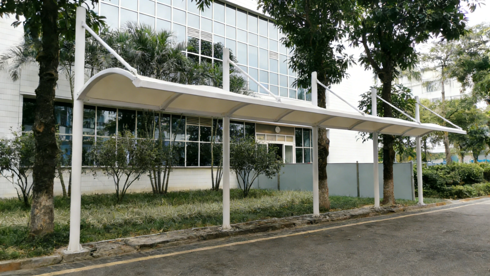 Cantilevered walkway canopy along a building facade